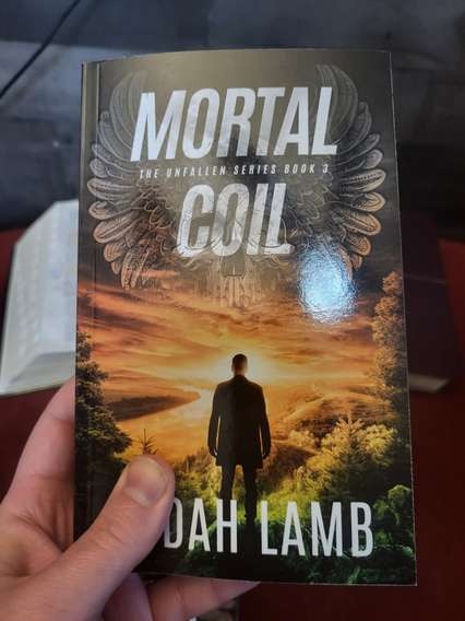 Mortal Coil paperback in hand